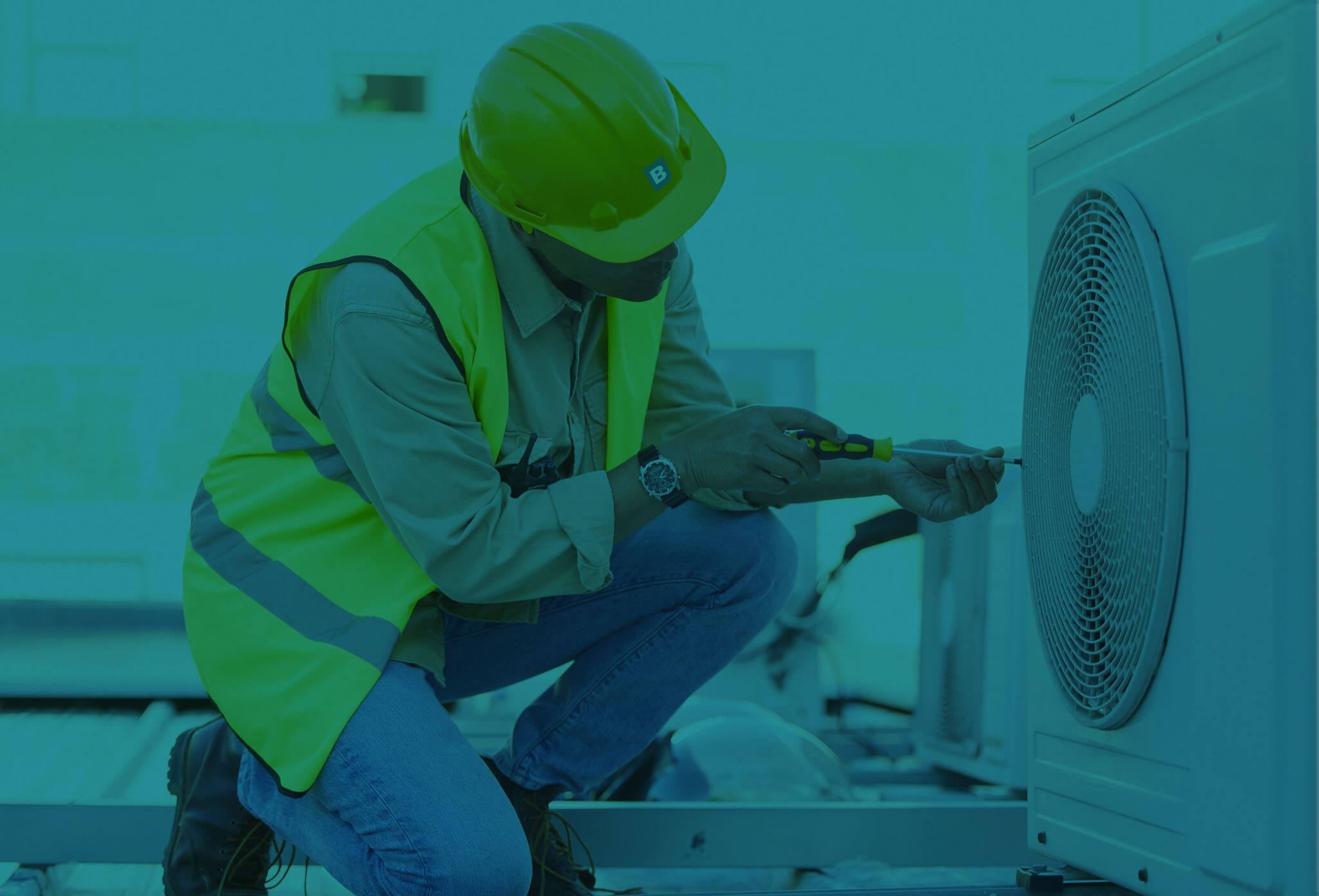 man fixing an exterior hvac unit